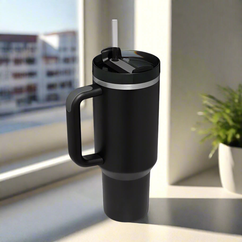Black insulated tumbler with handle and straw.